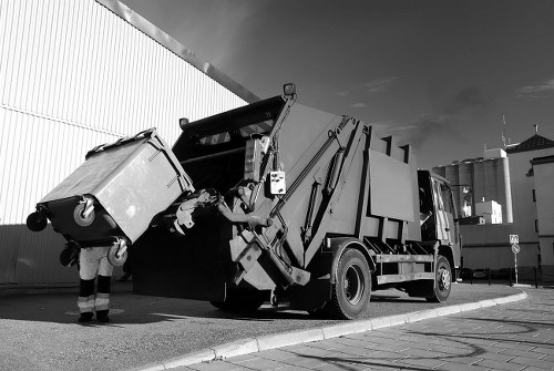 Battersea Skip Hire vehicle next to a residential property with skip on pavement