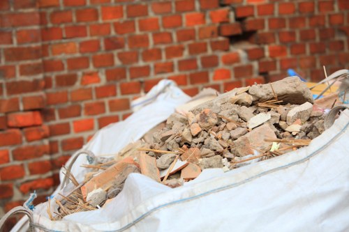 Workers sorting different types of demolition waste